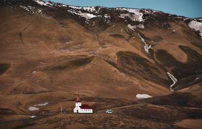 Mountainous landscape with church in Iceland